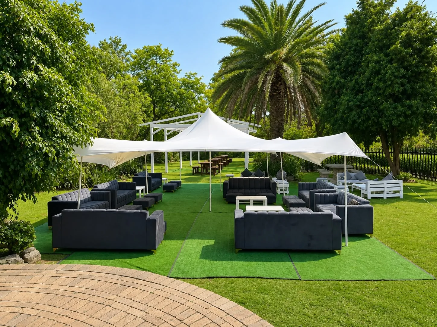 Outdoor garden lounge under shady event tents