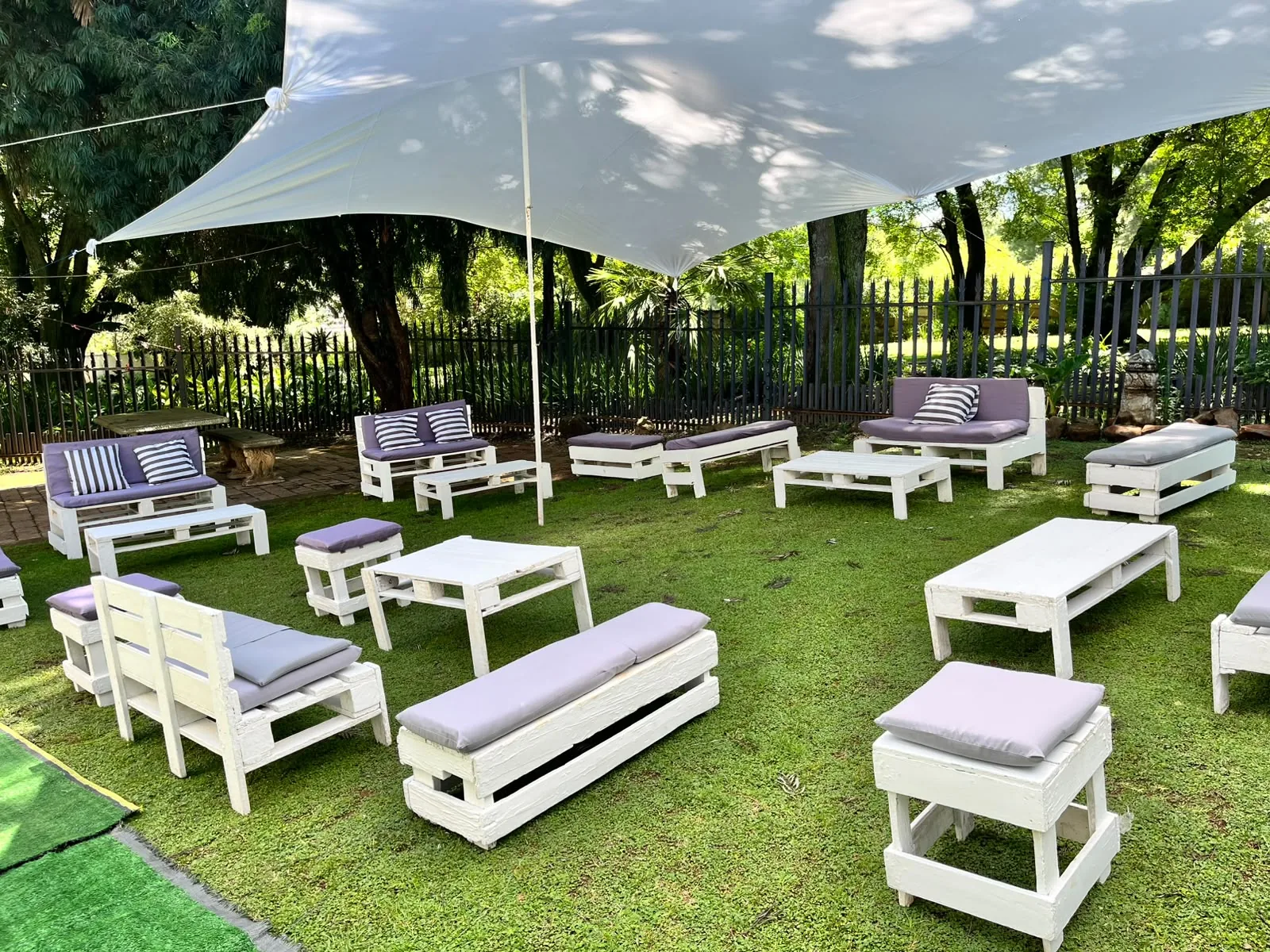 Outdoor lounge area under garden canopy